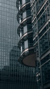 Minimalist glass skyscraper architecture representing HNI real estate net worth allocation in India