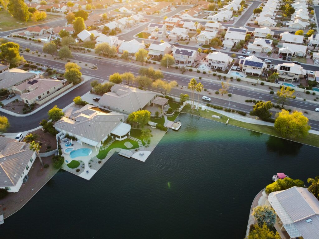 Aerial view of a private coastal estate among low-density waterfront residences, illustrating the scarce prime land supply driving India real estate appreciation